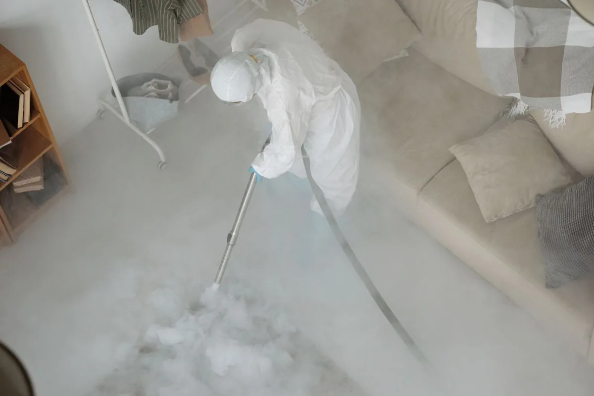 Biohazard cleanup technician in protective equipment, Mahtomedi, MN